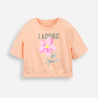 Camiseta infantil barra elástico com aplicação de paetê de flor laranja