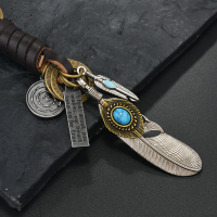 European and American new popular creative keychains men's and women's gifts alloy bronze horns retro woven cowhide pendant