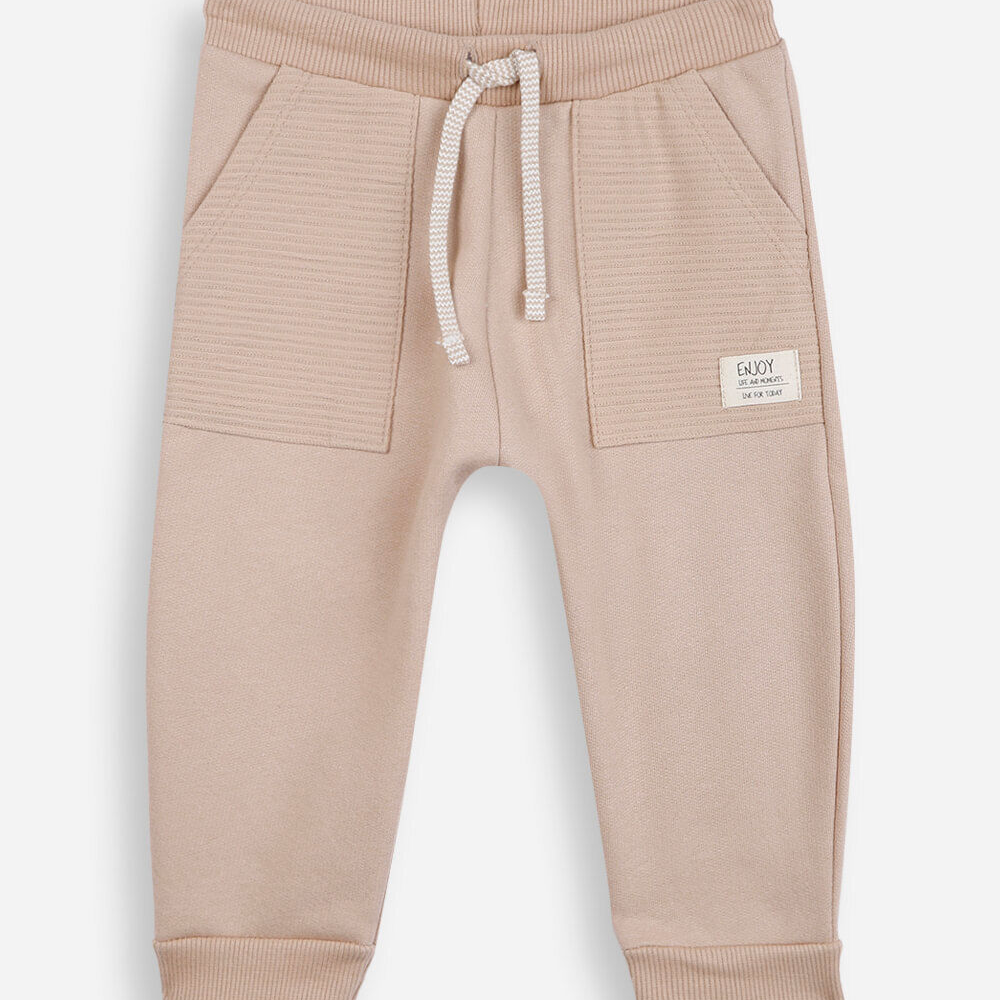 Calça de moletom infantil texturizada bege Calça de moletom infantil texturizada bege