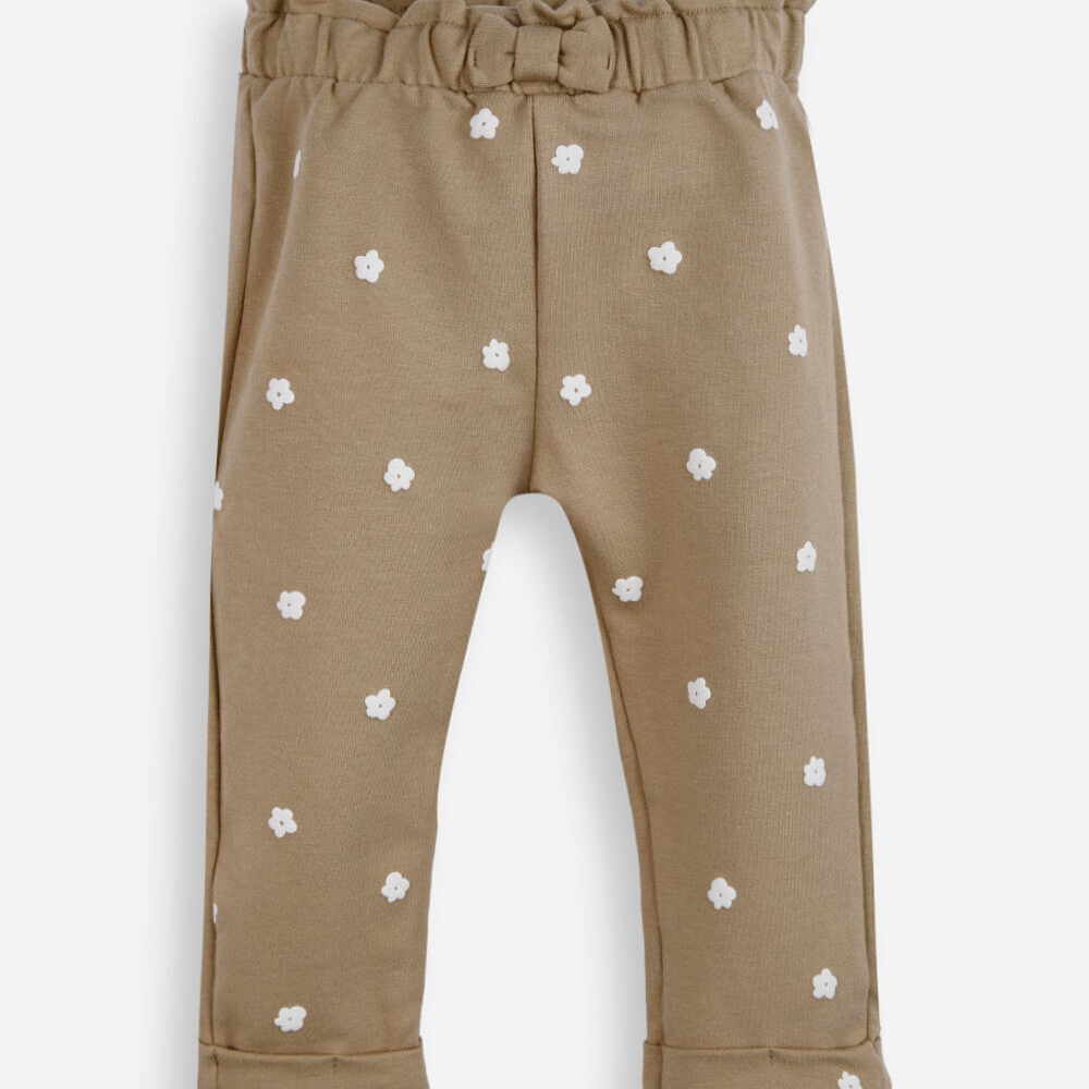 Calça clochard infantil de algodão floral bege Calça clochard infantil de algodão floral bege