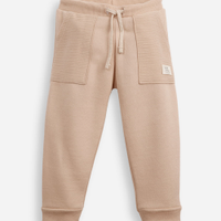Calça de moletom infantil texturizada bege